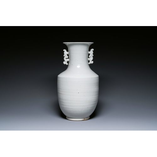 146 - A Chinese white-glazed vase on wooden stand, 19th C.Description:H.: 51,5 cm (the vase)H.: 70,5 cm (i... 