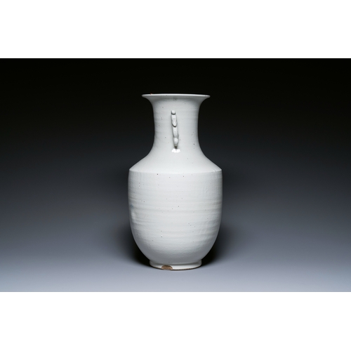 146 - A Chinese white-glazed vase on wooden stand, 19th C.Description:H.: 51,5 cm (the vase)H.: 70,5 cm (i... 