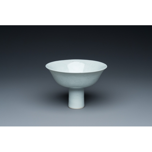 148 - A Chinese monochrome white-glazed stem cup with anhua dragon design, Qianlong mark, 18/19th C.Descri... 