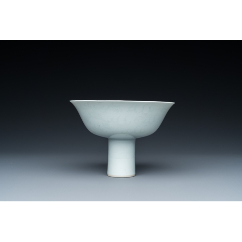 148 - A Chinese monochrome white-glazed stem cup with anhua dragon design, Qianlong mark, 18/19th C.Descri... 