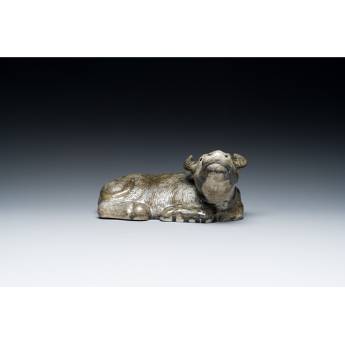 154 - A Chinese monochrome brown-grey-glazed sculpture of a reclining water buffalo on wooden stand, 19th ... 