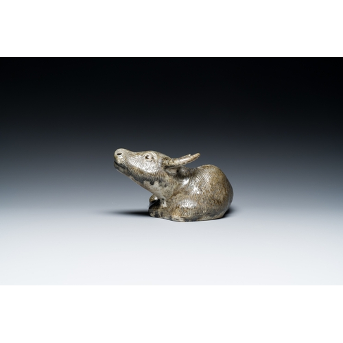 154 - A Chinese monochrome brown-grey-glazed sculpture of a reclining water buffalo on wooden stand, 19th ... 