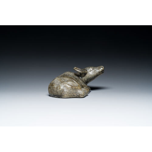 154 - A Chinese monochrome brown-grey-glazed sculpture of a reclining water buffalo on wooden stand, 19th ... 