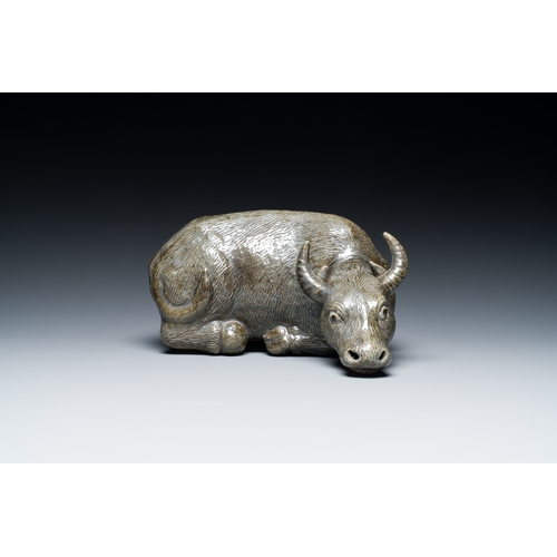 154 - A Chinese monochrome brown-grey-glazed sculpture of a reclining water buffalo on wooden stand, 19th ... 