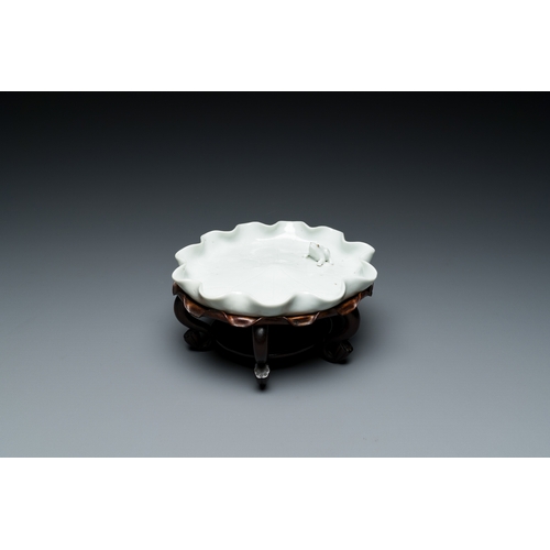 157 - A Chinese Dehua blanc de Chine 'frog on lotus flower' brush washer on a wooden stand, Kangxi/Yongzhe... 