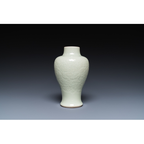 163 - A Chinese celadon-glazed vase with underglaze floral design, KangxiDescription:H.: 18 cmCondition re... 