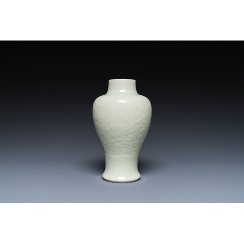 163 - A Chinese celadon-glazed vase with underglaze floral design, KangxiDescription:H.: 18 cmCondition re... 