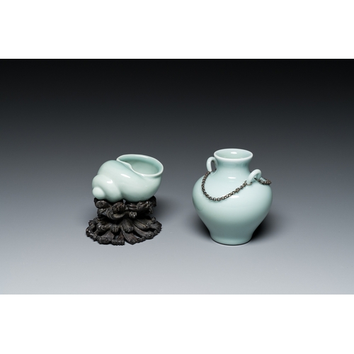 167 - A Chinese celadon-glazed water pot on wooden stand and a small 'hu' vase, 19/20th C.Description:H.: ... 