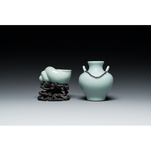 167 - A Chinese celadon-glazed water pot on wooden stand and a small 'hu' vase, 19/20th C.Description:H.: ... 