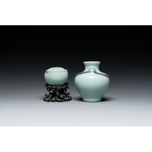 167 - A Chinese celadon-glazed water pot on wooden stand and a small 'hu' vase, 19/20th C.Description:H.: ... 