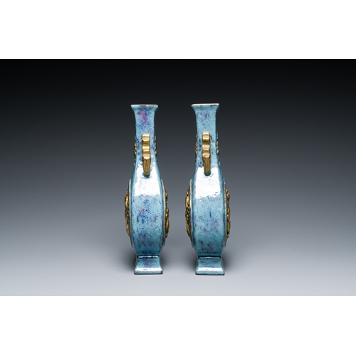 168 - A pair of Chinese flambe-glazed vases with gilt 'dragon' medallions, Qianlong mark, 19th C.Descripti... 