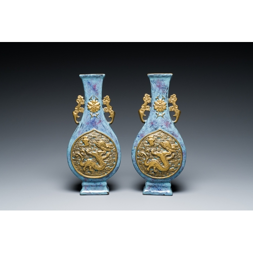 168 - A pair of Chinese flambe-glazed vases with gilt 'dragon' medallions, Qianlong mark, 19th C.Descripti... 