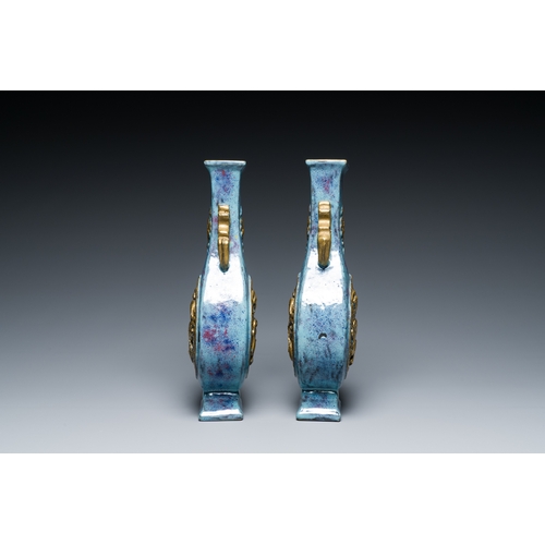 168 - A pair of Chinese flambe-glazed vases with gilt 'dragon' medallions, Qianlong mark, 19th C.Descripti... 