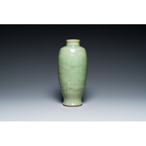 192 - A Chinese Longquan celadon vase with underglaze floral design, MingDescription:H.: 33,5 cm Provenanc... 