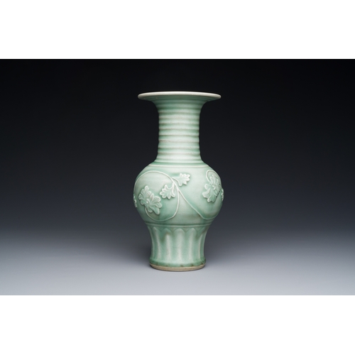 196 - A Chinese Longquan celadon 'peony scroll' vase, YuanDescription:H.: 22,5 cmCondition reports:Please ... 