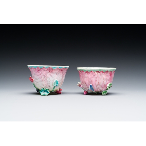 255 - A pair of Chinese relief-decorated famille rose 'lotus' cups and saucers with a scholar and his serv... 