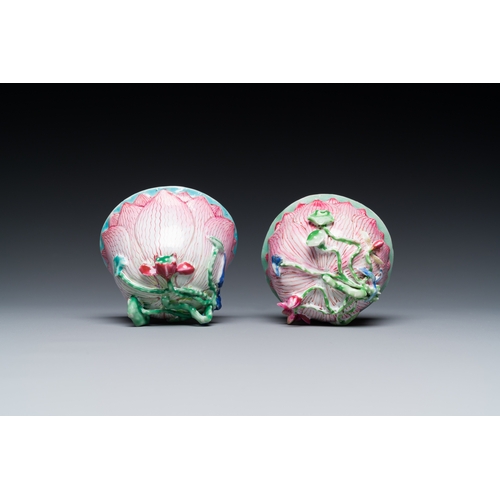 255 - A pair of Chinese relief-decorated famille rose 'lotus' cups and saucers with a scholar and his serv... 