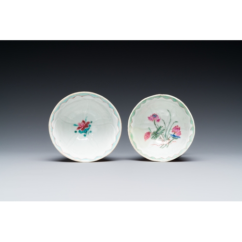 255 - A pair of Chinese relief-decorated famille rose 'lotus' cups and saucers with a scholar and his serv... 