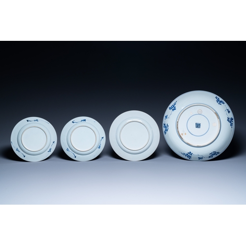 262 - A Chinese blue and white dish and three plates, Kangxi/YongzhengDescription:Dia.: 35,5 cm (the dish)... 