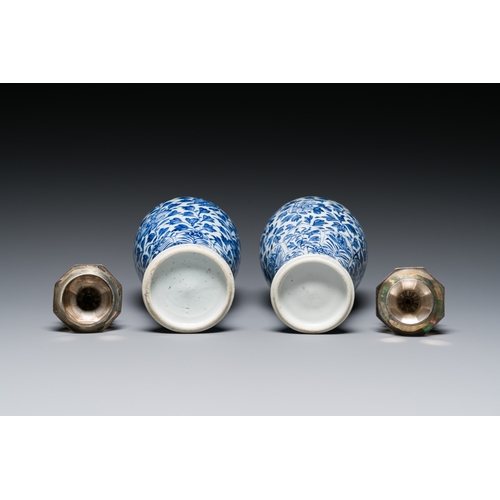 285 - A pair of Chinese blue and white vases with silver mounts, KangxiDescription:H.: 22 cm (the tallest)... 