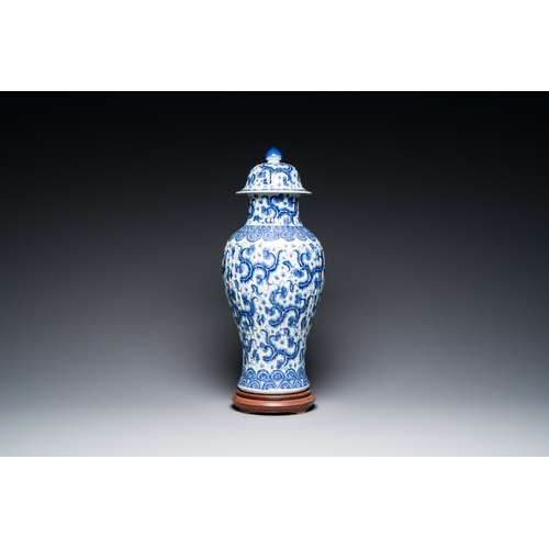 289 - A Chinese blue and white vase and cover with floral design, KangxiDescription:H.: 51 cm (the vase an... 