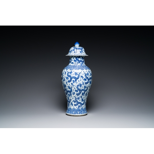 289 - A Chinese blue and white vase and cover with floral design, KangxiDescription:H.: 51 cm (the vase an... 