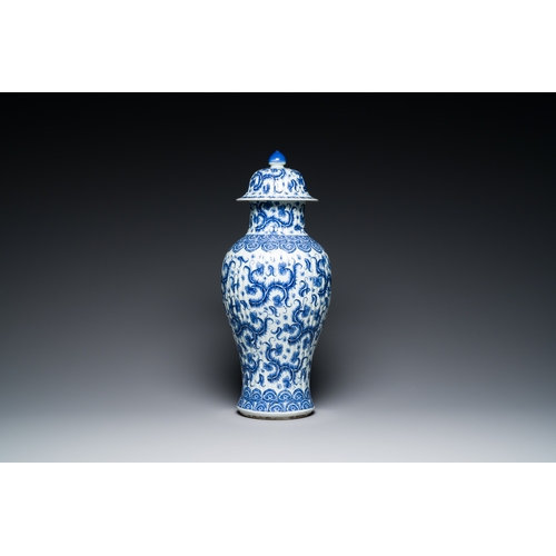 289 - A Chinese blue and white vase and cover with floral design, KangxiDescription:H.: 51 cm (the vase an... 