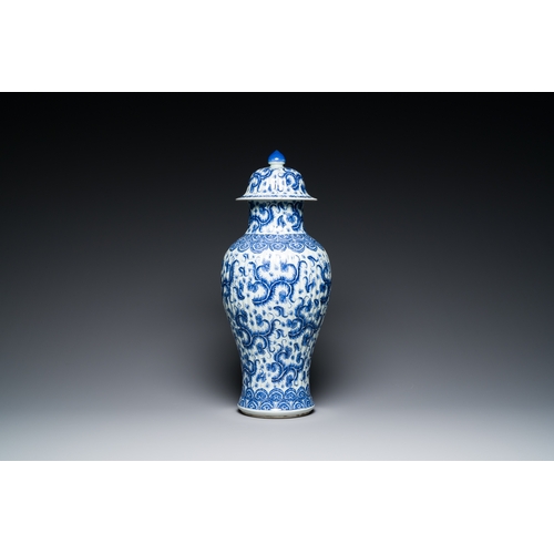 289 - A Chinese blue and white vase and cover with floral design, KangxiDescription:H.: 51 cm (the vase an... 