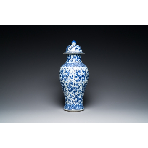 289 - A Chinese blue and white vase and cover with floral design, KangxiDescription:H.: 51 cm (the vase an... 