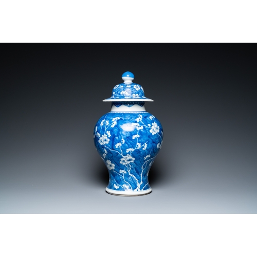 296 - A Chinese blue and white 'prunus on cracked ice' vase and cover, KangxiDescription:H.: 44,5 cm Condi... 