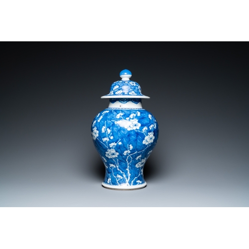 296 - A Chinese blue and white 'prunus on cracked ice' vase and cover, KangxiDescription:H.: 44,5 cm Condi... 