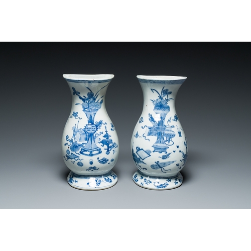 306 - A pair of Chinese blue and white wall pocket vases with antiquities, KangxiDescription:H.: 29 cmCond... 