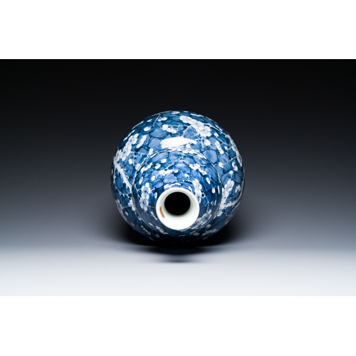 311 - A Chinese blue and white double gourd 'prunus on cracked ice' vase, 18th C.Description:H.: 49 cmCond... 