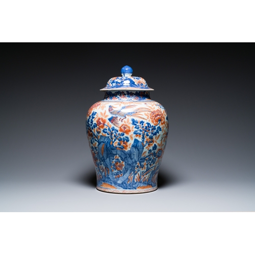 317 - A Chinese blue, white and copper-red Imari-style vase and cover, KangxiDescription:H.: 58 cm (the va... 