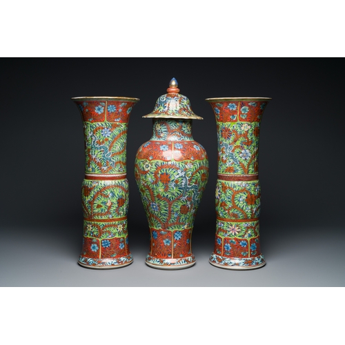 336 - A Chinese English-decorated blue and white garniture of three vases, KangxiDescription:H.: 56 cm (va... 