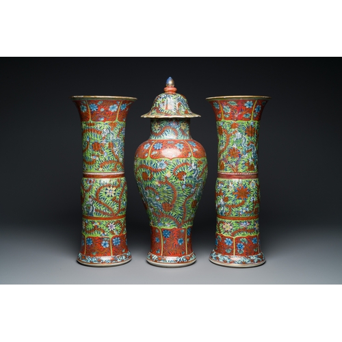 336 - A Chinese English-decorated blue and white garniture of three vases, KangxiDescription:H.: 56 cm (va... 