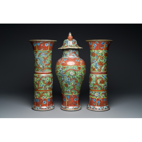 336 - A Chinese English-decorated blue and white garniture of three vases, KangxiDescription:H.: 56 cm (va... 