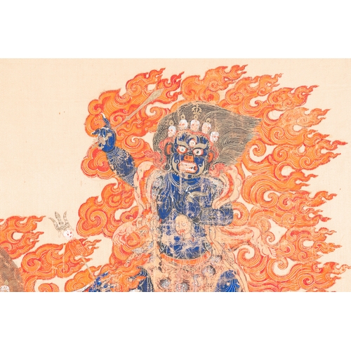 395 - A silk thangka depicting Mahakala, Tibet, 19th C.Description:Dim.: 79 x 78 cm (the frame)Dim.: 64,5 ... 