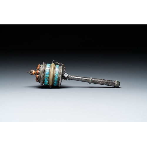 401 - A Tibetan silver prayer wheel with turquoise and coral inlay, 19th C.Description:L.: 25 cmCondition ... 