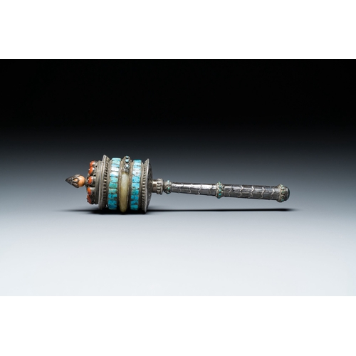 401 - A Tibetan silver prayer wheel with turquoise and coral inlay, 19th C.Description:L.: 25 cmCondition ... 