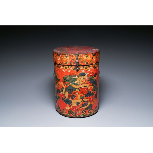 404 - A large leather-clad wooden box and cover painted with dragons on a red ground, Tibet, 17/18th C.Des... 