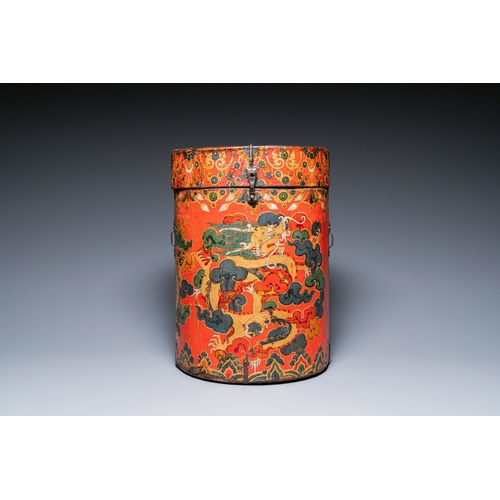 404 - A large leather-clad wooden box and cover painted with dragons on a red ground, Tibet, 17/18th C.Des... 