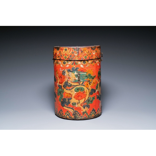 404 - A large leather-clad wooden box and cover painted with dragons on a red ground, Tibet, 17/18th C.Des... 