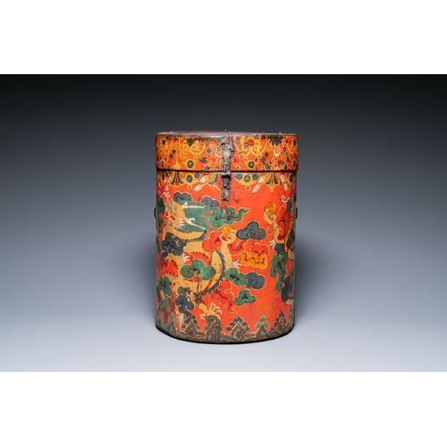 404 - A large leather-clad wooden box and cover painted with dragons on a red ground, Tibet, 17/18th C.Des... 