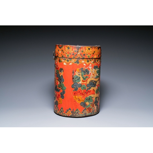 404 - A large leather-clad wooden box and cover painted with dragons on a red ground, Tibet, 17/18th C.Des... 