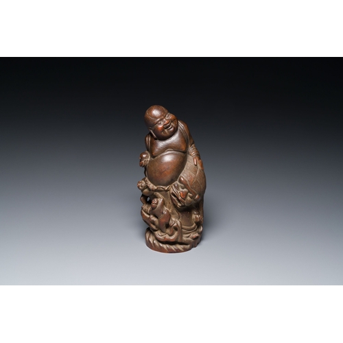 413 - A Chinese bamboo sculpture of Buddha, 18/19th C.Description:H.: 26,5 cmCondition reports:Please cont... 