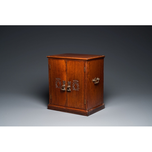 416 - A Chinese huanghuali and hardwood cabinet with bronze fittings for the European market, 19th C.Descr... 