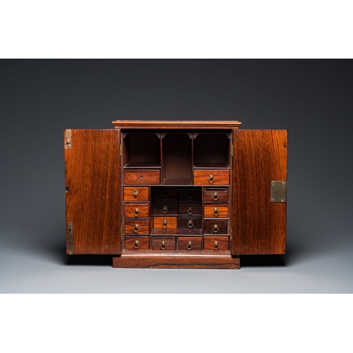 416 - A Chinese huanghuali and hardwood cabinet with bronze fittings for the European market, 19th C.Descr... 