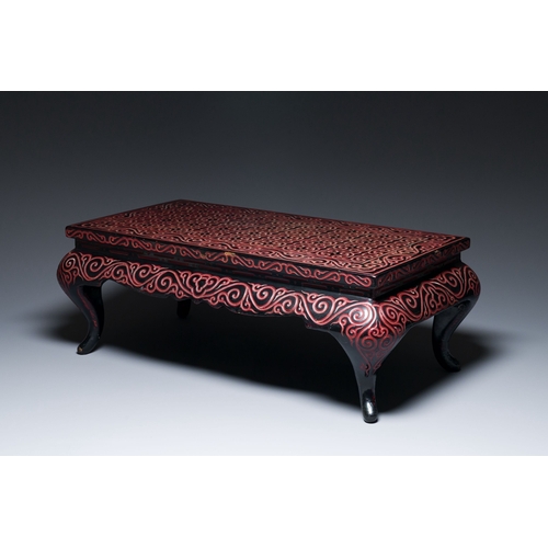 422 - A Chinese rectangular carved red and black lacquer table, 'kang', Xuande mark, 20th C.Description:Di... 