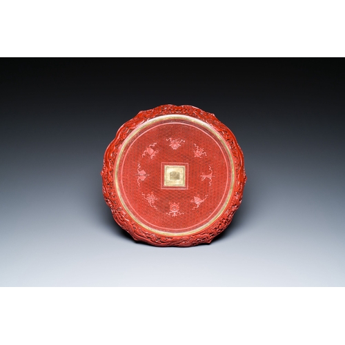 424 - A Chinese red cinnabar lacquer lotus-shaped dish, Qianlong mark, probably RepublicDescription:Dia.: ... 